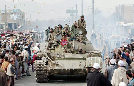 Kabul people welcome Northern Alliance troops, November 13, 2001.