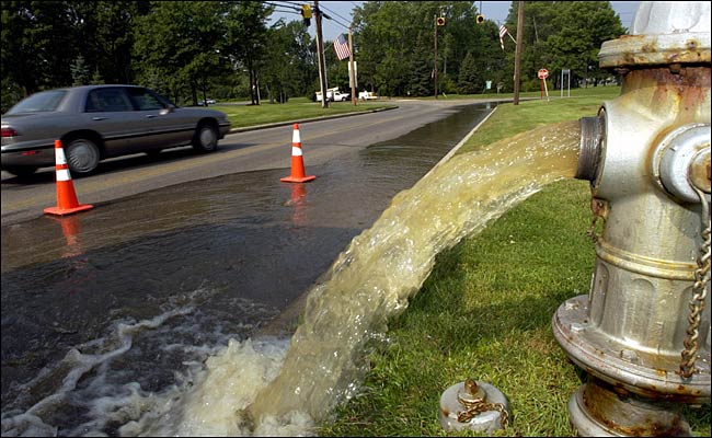 A water sewer being drained to street, Pepper Pike, Ohio, August 15, 2003.