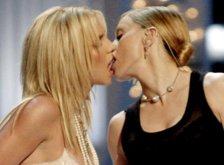 Britney Spears gets a kiss on the mouth from Madonna as they open the 2003 MTV Video Music Awards show, Radio City Music Hall, New York, August 28, 2003.
