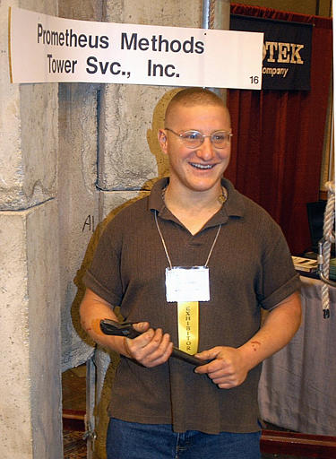This photo dated October 2003 shows Nick Berg standing under a banner of his company Prometheus Methods while attending an engineering conference in Hershey, Pa. Berg was beheaded by Abu Musab aZarqawi, Al Qaeda's leader in Iraq, May 11, 2004.