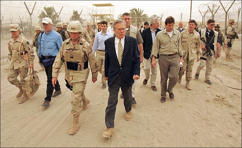 With Maj. Gen. Geoffrey Miller at his side, Defense Secretary Donald H. Rumsfeld made a whirlwind visit to the Abu Ghraib prison, Baghdad, May 13, 2004.