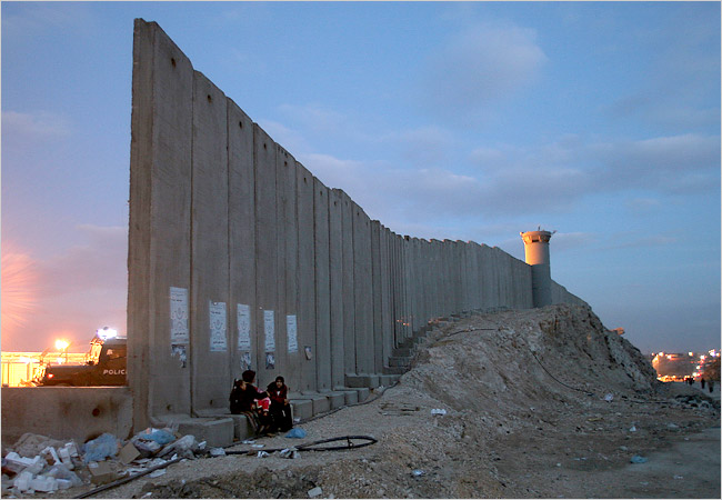 Near Jerusalem, Israel's separation barrier includes concrete walls about 10 meter high; this one is near the Qalandiya crossing, April 2006.