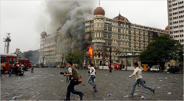In the fourth day of attacks, the landmark Taj Mahal Palace & Tower Hotel, continues burning for the third day on, after it was set into fire by Muslim invaders whose teams stormed luxury hotels, a popular restaurant, a crowded train station and a Jewish group's headquarters, killing people, and holding Westerners hostage in coordinated attacks on the India's commercial center, Mumbai, November 29, 2008.