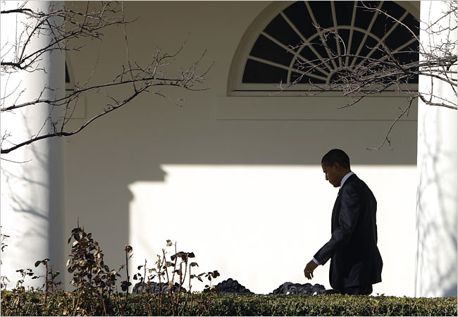 Barack Hussein Obama, head down, returns to the Oval Office, a day on which two of his appointees withdrew over tax problems, February 3, 2008.