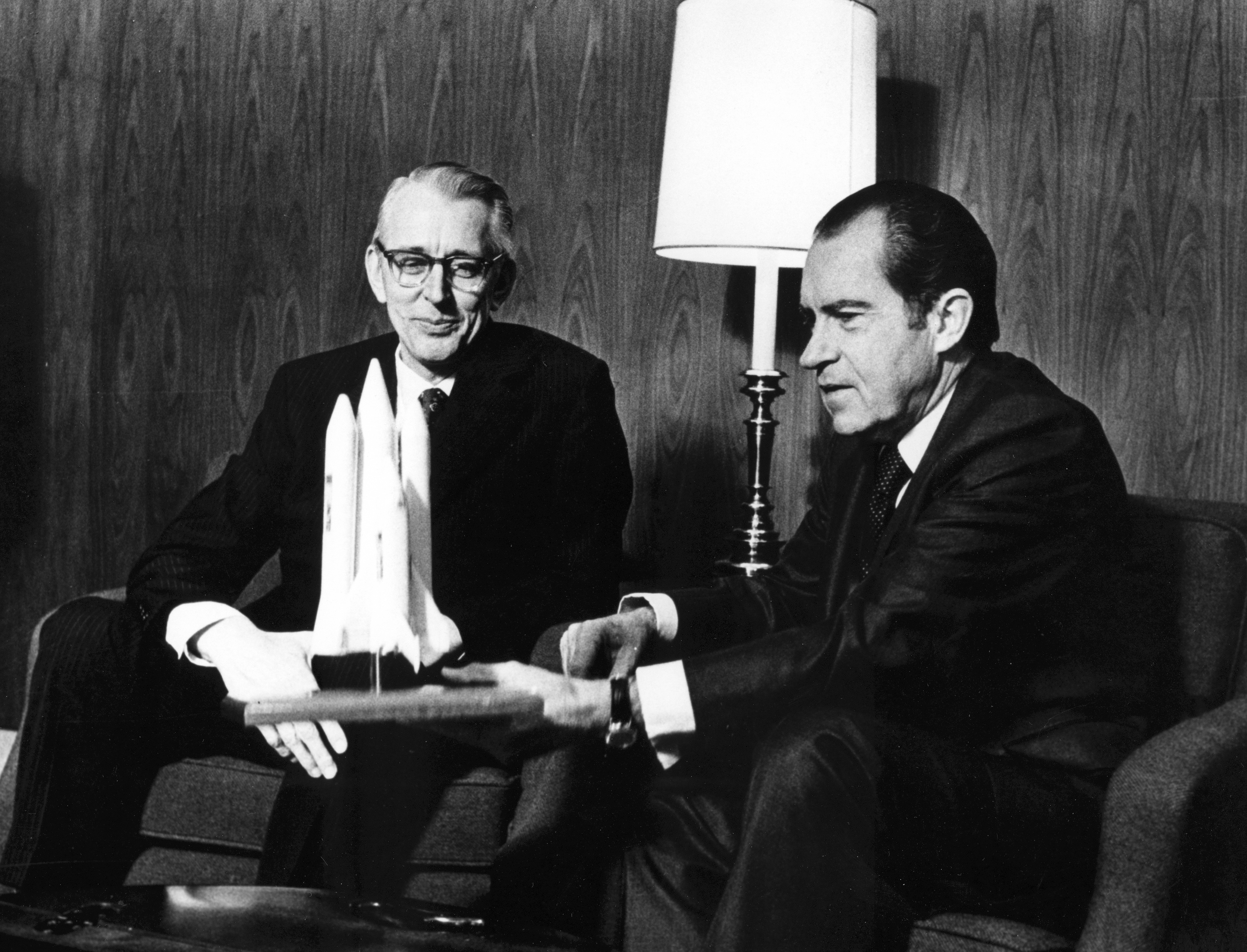 U.S. President Richard M. Nixon and Dr. James C. Fletcher, NASA Administrator, discuss the proposed Space Shuttle vehicle, just before President announcement that the United States should proceed at once with the development of an entirely new type of space transportation system designed to help transform the space frontier into familiar territory, San Clemente, California, January 5, 1972.
