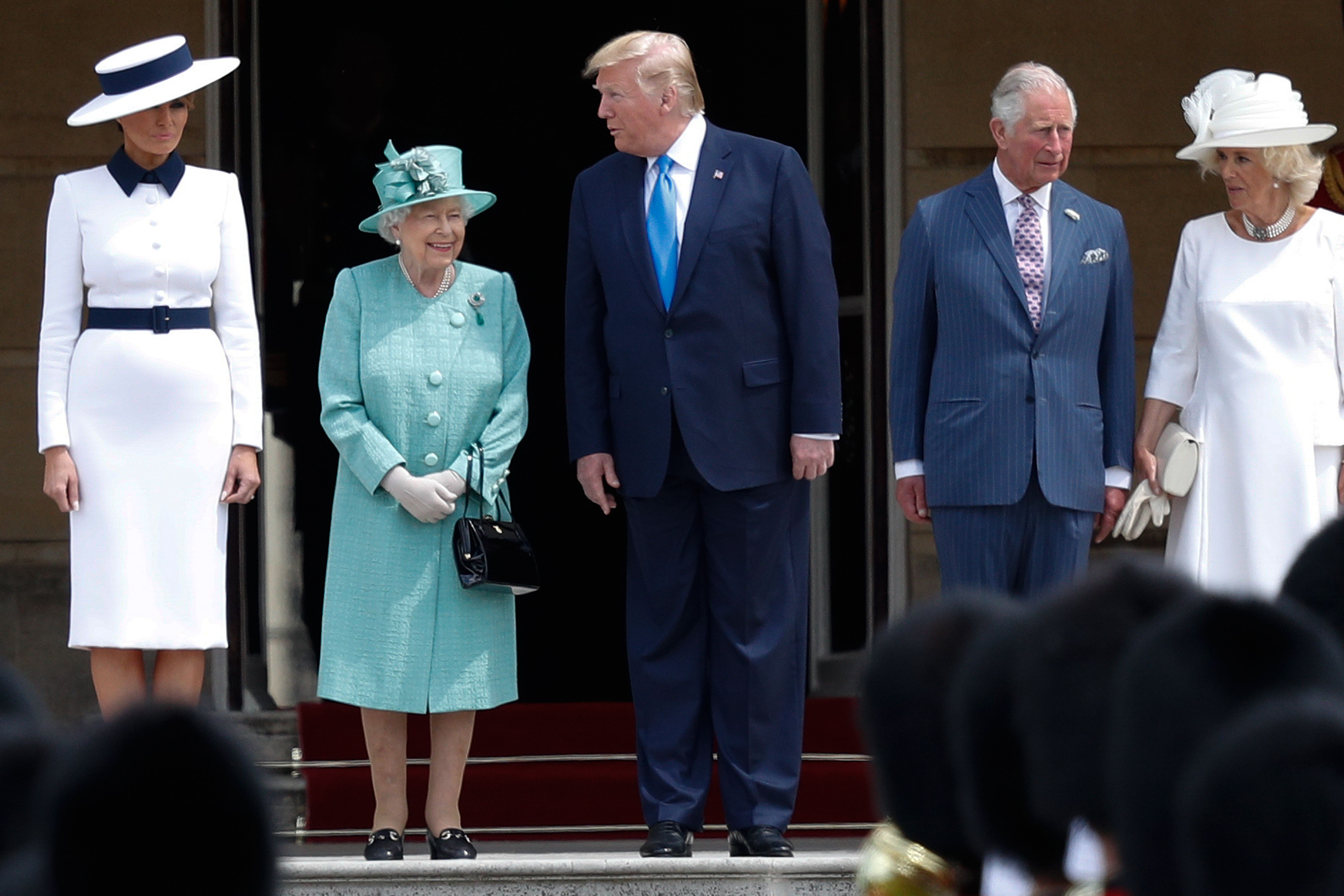 US First Lady Melania Trump, Britain's Queen Elizabeth II, US President Donald Trump, Britain's Prince Charles, Prince of Wales and Britain's Camilla, Duchess of Cornwall pose for a photograph during a ceremonial welcome in the garden of Buckingham Palace on the opening day of a three day state visit to Britain, London, June 3, 2019.