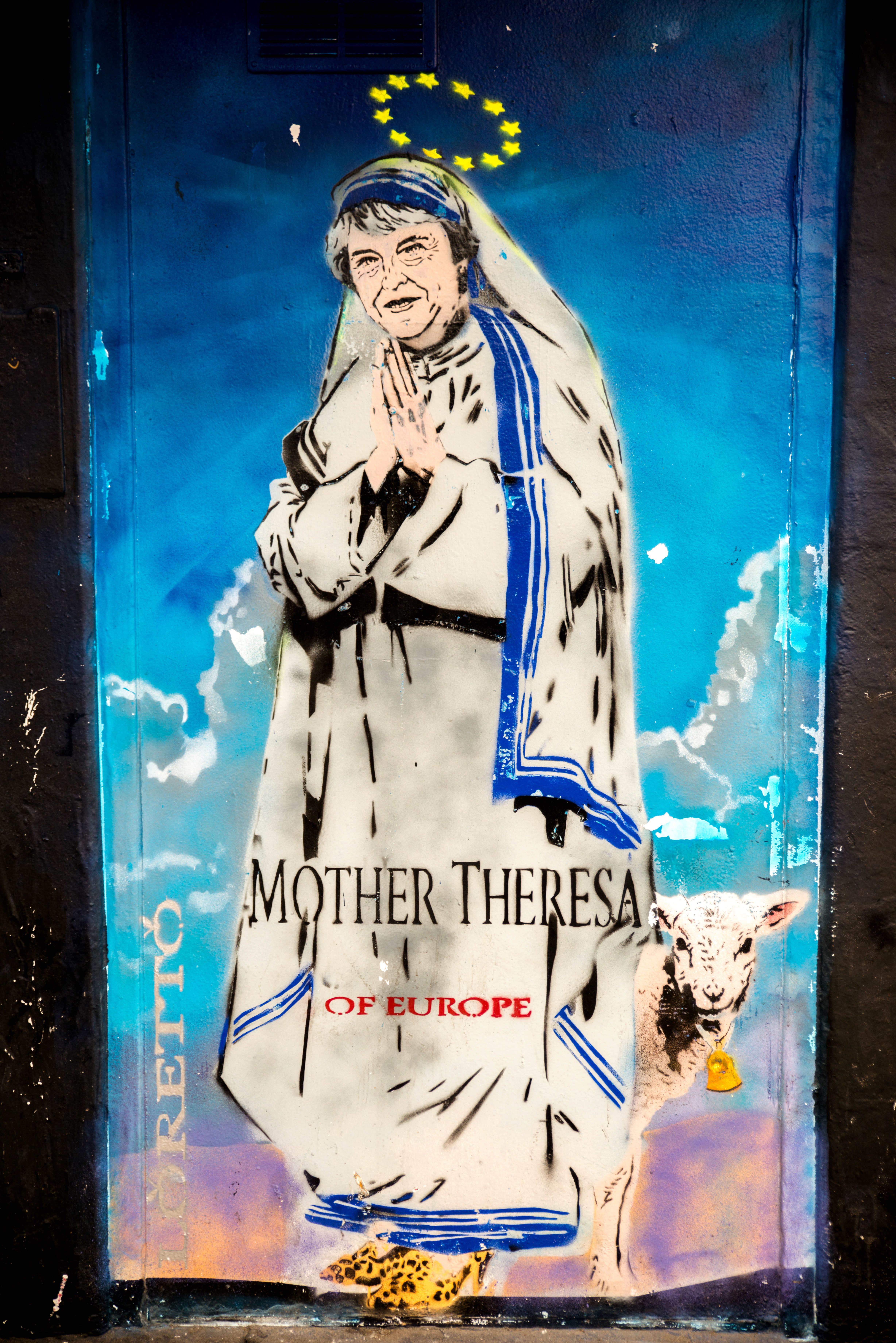 Mother Theresa of Europe graffiti depicts Theresa May as Mother Teresa, Shoreditch High Street, London, early 2018.