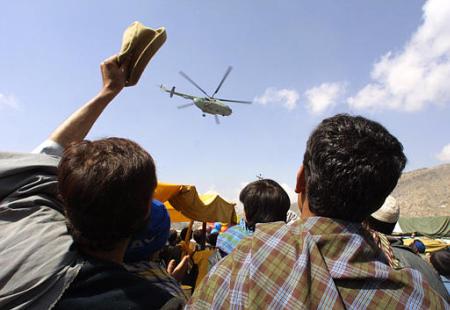 U.S. military helicopters share Afghan people the celebration of the Afghan New Year, Kabul, March 21, 2002.