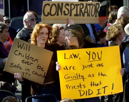 Demonstrators call for the resignation of Roman Catholic Cardinal Bernard Law outside the Cathedral of the Holy Cross in Boston.