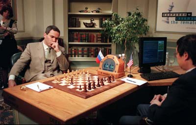 Feng-hsuing Hsu of the Deep Blue development team enters Garry Kasparov's moves into Deep Blue, an IBM RS6000, and vice versa, The Kasparov/Deep Blue Rematch, Deep Blue war room, the 35th floor, Equitable Center, Manhattan, First game, May 3, 1997.