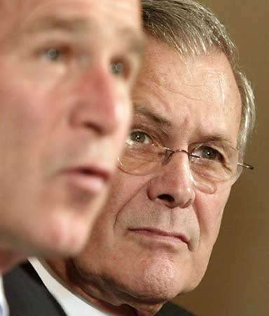 Defense Secretary Donald Rumsfeld and President George W. Bush, Cabinet Meeting, Cabinet Room, White House, November 13, 2002.