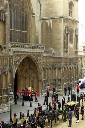 The coffin of Britain's Queen Mother, arrives at London's Westminster Hall, Friday, April 5, 2002.