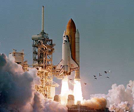 Space shuttle Atlantis lifts off from the Kennedy Space Center.