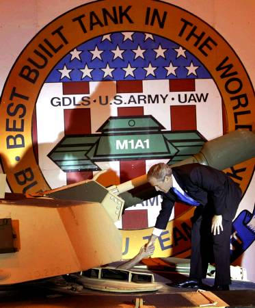 U.S. President George W. Bush shakes a hand of a plant worker, the Abrams M1A1 Lima Army Tank Plant, Lima, Ohio, April 24, 2003.