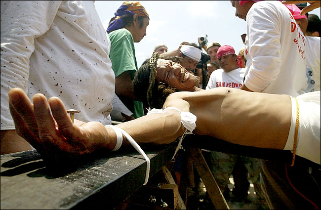 Ruben Enaje, 47, was one of 14 people nailed to a cross in Cutud, Philippines, April 18, 2003.