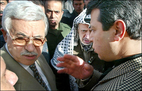 Prime Minister-designate Mahmoud Abbas, left, Yasser Arafat and Mohammed Dahlan, the new Internal Security Minster, Ramallah, April 23, 2003.