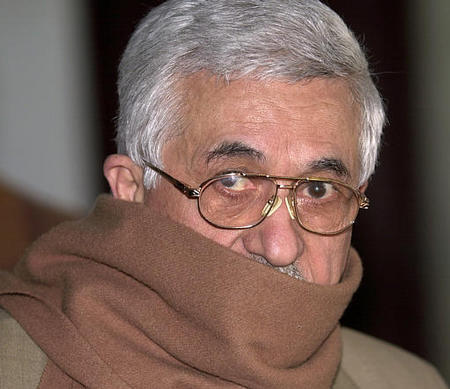 Mahmoud Abbas, also known as Abu Mazen leaves his office after his meeting with Palestinian Legislative Council spokesman Ahmed Qurea', Ramallah, April 22, 2003.