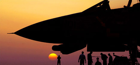U.S. sailors and an F-14 Tomcat aboard the carrier Abraham Lincoln, Persian Gulf, March 10, 2002.