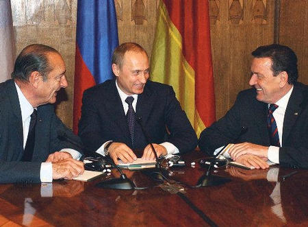 Russian President Vladimir Putin, center, French President Jacques Chirac, and German Chancellor Gerhard Schroeder, St. Petersburg, Russia, April 11, 2003.