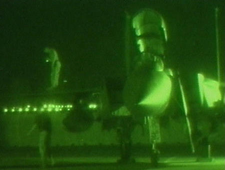 U.S. military mechanics work on a plane, Gulf region, circa March 19, 2003.