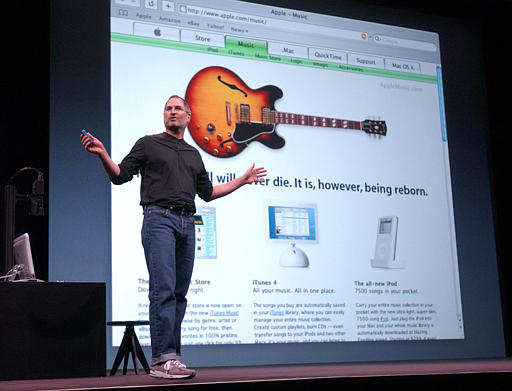 Apple Computer chief executive Steve Jobs introduces the new 'iPod' during Apple's launch of their new online 'Music Store,' San Francisco, April 28, 2003.