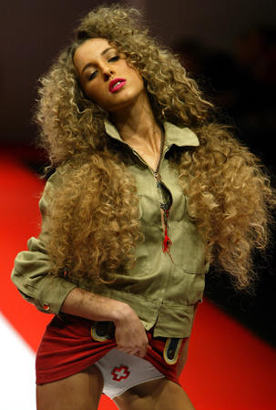Ayesha Makin, a niece of the Duchess of York, flashes Australian designer Fashionassassin's label at a show during Australian Fashion Week, Sydney, May 7, 2003.