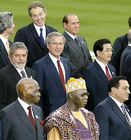 President Bush is surrounded by other world leaders during a group photo session of the G-8 Outreach Group, Evian, France, June 1, 2003.