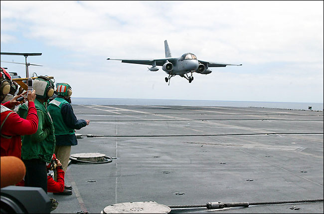 The first aircraft has been designated Navy One, a S-3B Viking jet piloted by John 'Skip' Lussier who was assisted by President George W. Bush, caught only the last of the four cables set up to catch the planes before they must take off again or end up in the sea, aboard the aircraft carrier USS Abraham Lincoln, off the California coast, May 1, 2003.