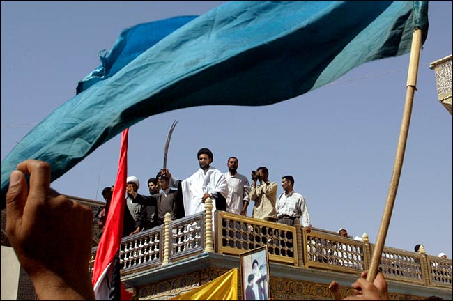 Clerics, speaking to protesters from atop a mosque, demanded an end to the American occupation, Najaf, July 20, 2003.