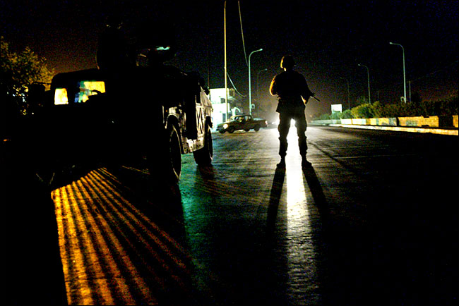 An American soldier on night patrol, Tikrit, early August 2003.
