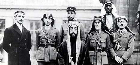 Prince Faysal, later to be king of Iraq, front, and T. E. Lawrence (Lawrence of Arabia), row behind second from right, Paris Peace Conference, 1919.