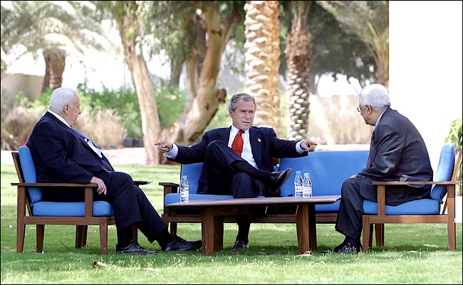 Ariel Sharon, the prime minister of Israel, President Bush and Mahmoud Abbas, the Palestinian prime minister, Aqaba, Jordan, June 4, 2003.