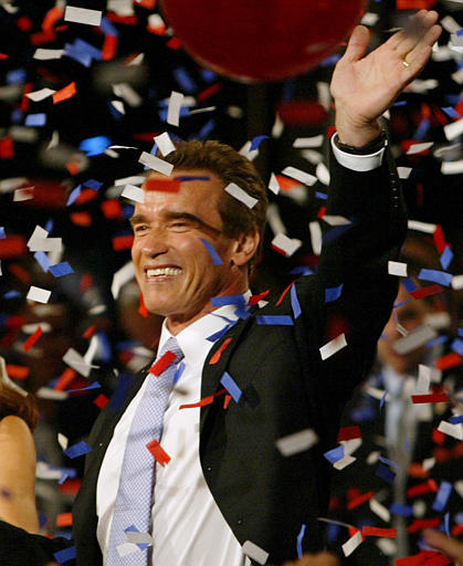 Arnold Schwarzenegger celebrates his victory in the California gubernatorial recall election at his election night headquarters, Los Angeles, October 7, 2003.