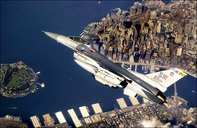 An Air Force F-16 CJ Fighting Falcon flew over New York during a Norad mission as military pilots practice how to shoot down hijacked airliners as often as three to four times a week, Manghattan, September 2002.
