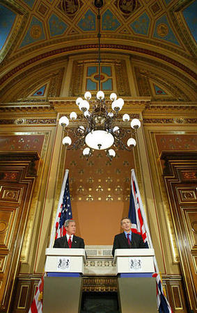 Britain's Prime Minister Tony Blair and President Bush address a joint news conference at the Foreign and Commonwealth Offices, London, November 20, 2003.