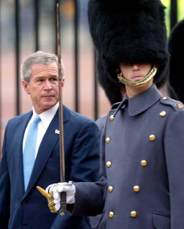 US President George W. Bush, who is on a State visit to Britain, inspects the Guard of Honor, during the official welcoming ceremony at Buckingham Palace, central London, November 19, 2003.