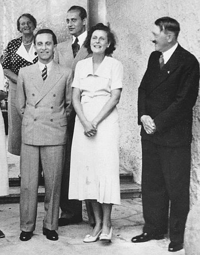 Leni Riefenstahl, stands with Adolf Hitler and Propaganda Minister Joseph Goebbels, foreground left, her mansion, Berlin, March 10, 1938.