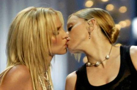 Britney Spears gets a kiss on the mouth from Madonna as they open the 2003 MTV Video Music Awards show, Radio City Music Hall, New York, August 28, 2003.