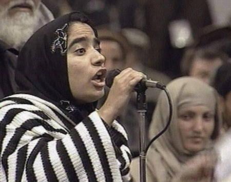 Malalai Joya, one of abut 100 female delegates to the 500-member landmark constitutional council in Afghanistan speaks during the morning session of the council, December 17, 2003.