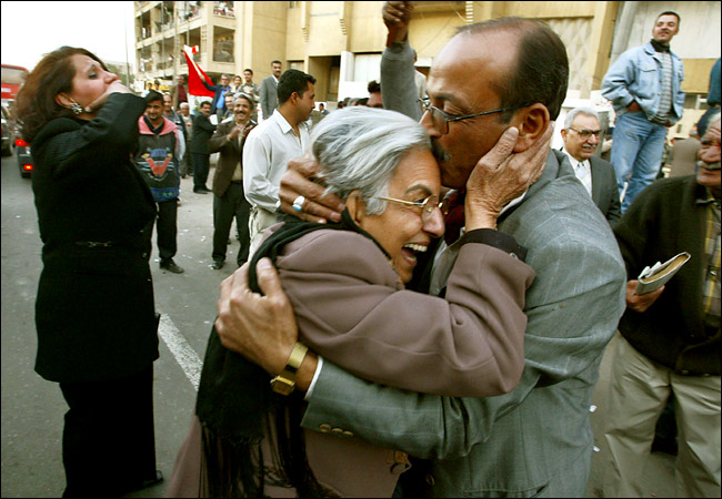 Iraqis danced in the streets of Baghdad after hearing the news of Saddam Hussein's capture, on which they said they had not seen such celebrations in the streets since the end in the late 1980's of the disastrous Iran-Iraq War, December 14, 2003.