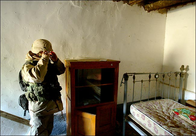 An American soldier took a photograph of the bedroom used by Saddam Hussein in the Iraqi village of Ad Dwar, where Mr. Hussein hid, December 19, 2003.