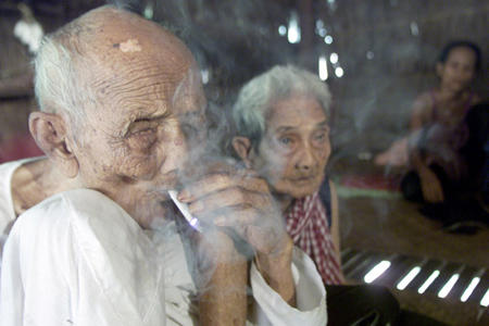 Officially it's impossible to verify if they are the world's oldest couple because documents were destroyed during the 1970s Khmer Rouge genocide. Cambodian Sek Yi, whose relatives say is 122-years-old, sits with his 108-year-old wife Long Ouk in their bamboo hut in the village of Tuk Young, some 200 km east of the capital Phnom Penh, October 14, 2003.