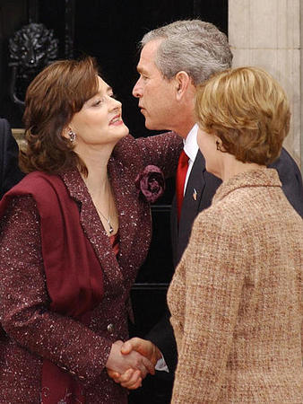 British Prime Minister Tony Blair's, wife, Cherie, welcomes U.S. President George W. Bush and his wife, Laura, outside the Prime Minister's official residence, London's Downing Street, November 20, 2003.