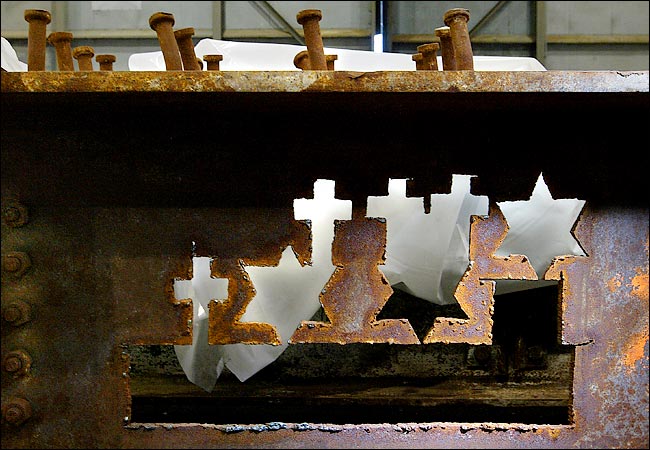 Workers had cut out crosses and Star of David symbols in one beam of WTC, New York, some date after September 11, 2001.