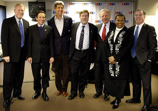 Presidential hopefuls Dick Gephardt, Dennis Kucinich, John Kerry, Joseph Lieberman, Carol Moseley Braun and Howard Dean, pose with National Public Radio's Neal Conan, center, in a photo following a radio debate, Des Moines, Iowa, January 6, 2004.