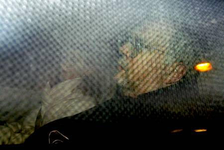 Former chairman of the BBC Gavyn Davies leaves BBC offices with an unidentified woman after resigning, Portland Place, central London, January 28, 2004.