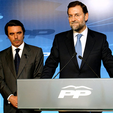 The outgoing Prime Minister Jos Maria Aznar looks on as Mariano Rajoy, who was running as the Popular Party's candidate for prime minister, conceded defeat, Madrid, Spain, March 14, 2004.