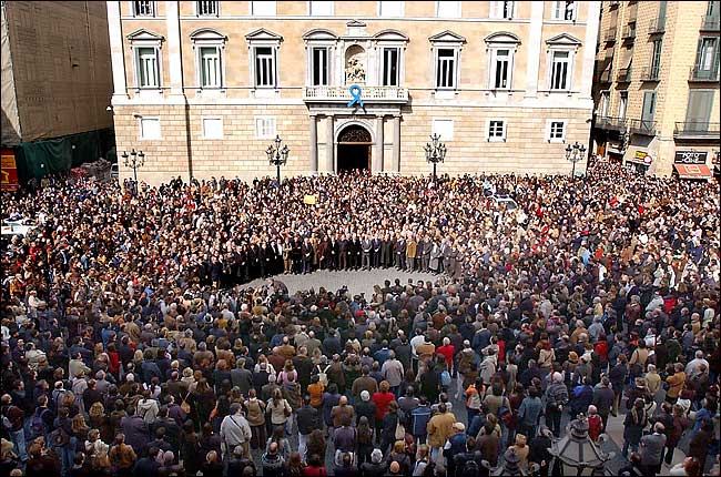 Thousands of people gathered to observe five minutes of silence to pay homage to the victims of the day's morning attacks in Madrid, San Jaume Square, Barcelona, March 11, 2004.