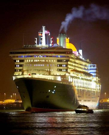 The Queen Mary 2, largest, longest, tallest, widest and grandest ocean liner ever built (Cunard's transatlantic $880 million, 150,000-ton vessel that can carry 2,620 passengers and 1,253 crew members), departs on her maiden voyage from Southampton bound for Fort Lauderdale, braving a nasty North Atlantic winter storm en route to sunny Florida, January 12, 2003.