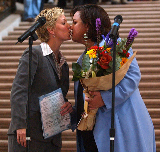 Comedian, Actress and Former talk show host Rosie O'Donnell, right, kisses her partner Kelli Carpenter after their marriage at the City Hall, San Francisco, February 26, 2004.